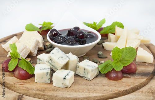 cheese plate with several varieties of cheese in the restaurant