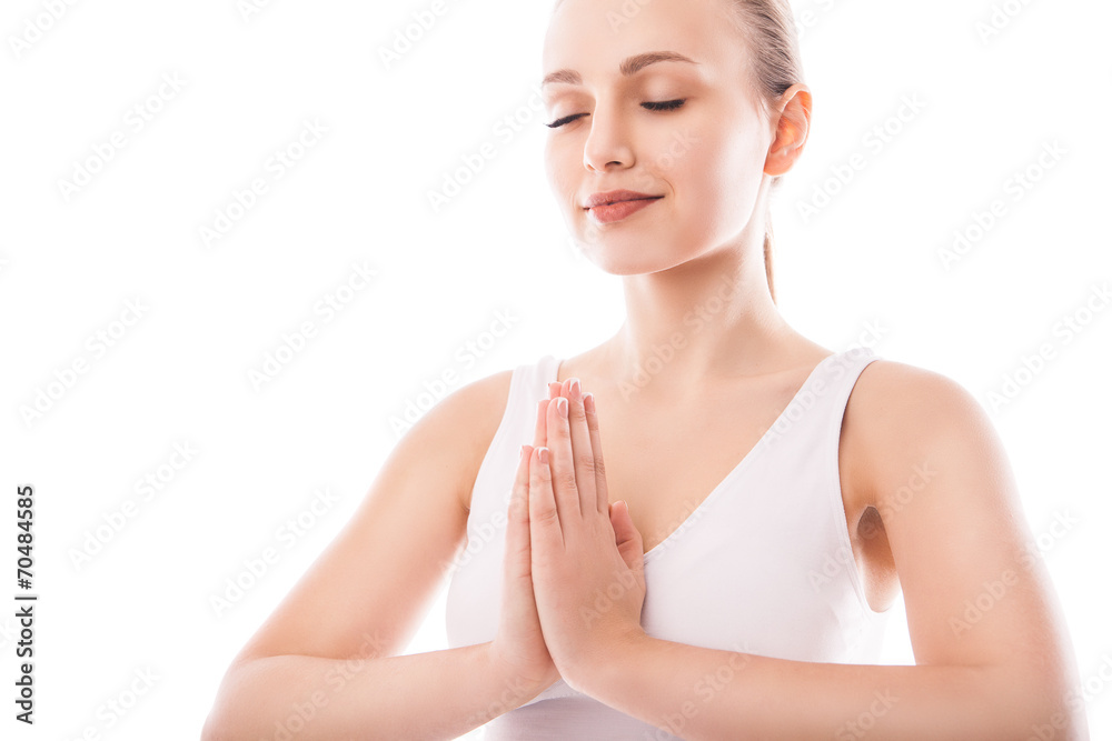 Young woman sitting in lotus position isolated Young woman sitting in lotus position isolated