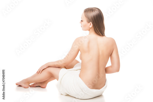 Young beautiful woman wrapped in towel after bath