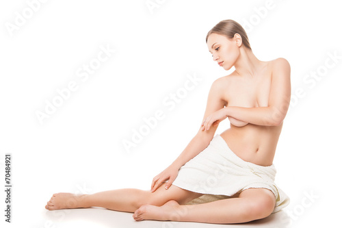 Young beautiful woman wrapped in towel after bath