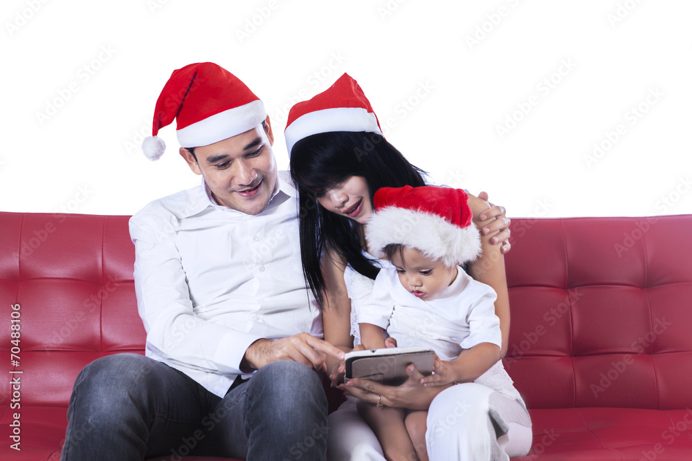 Christmas family using digital tablet Christmas family using digital tablet