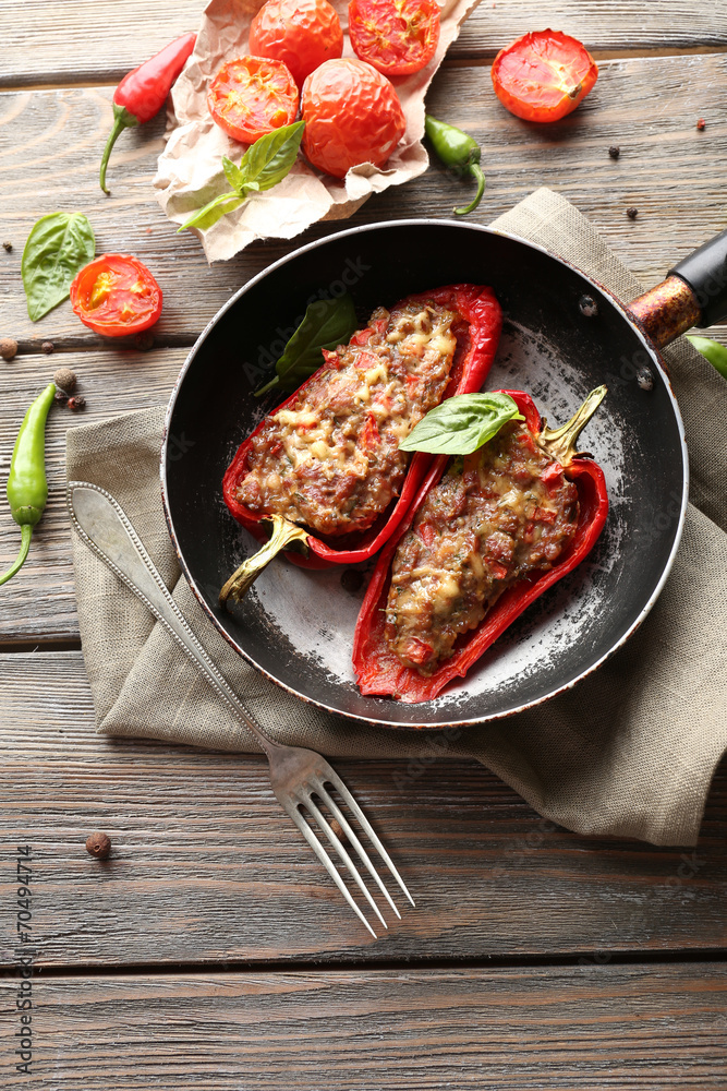 Delicious stuffed peppers in frying pan on table close-up Delicious stuffed peppers in frying pan on table close-up
