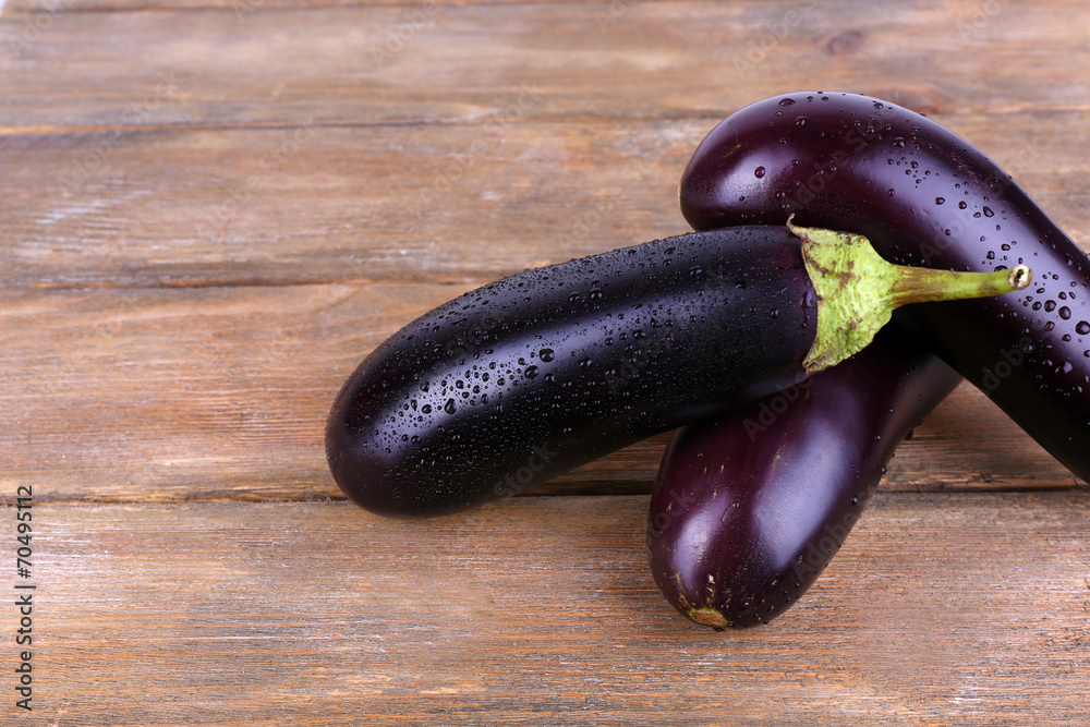 Aubergines on wooden background