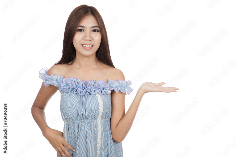 Beautiful Asian woman present something and smile Beautiful Asian woman present something and smile