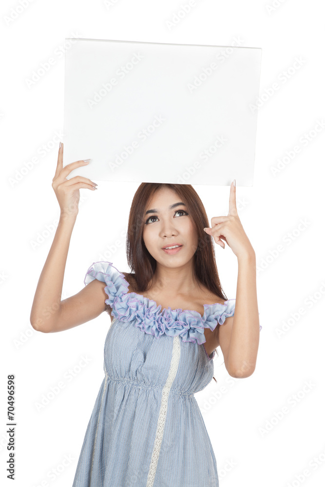 Beautiful Asian woman point to blank sign over head Beautiful Asian woman point to blank sign over head