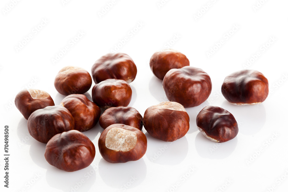 Chestnut on white background. ripe chestnuts Chestnut on white background. ripe chestnuts