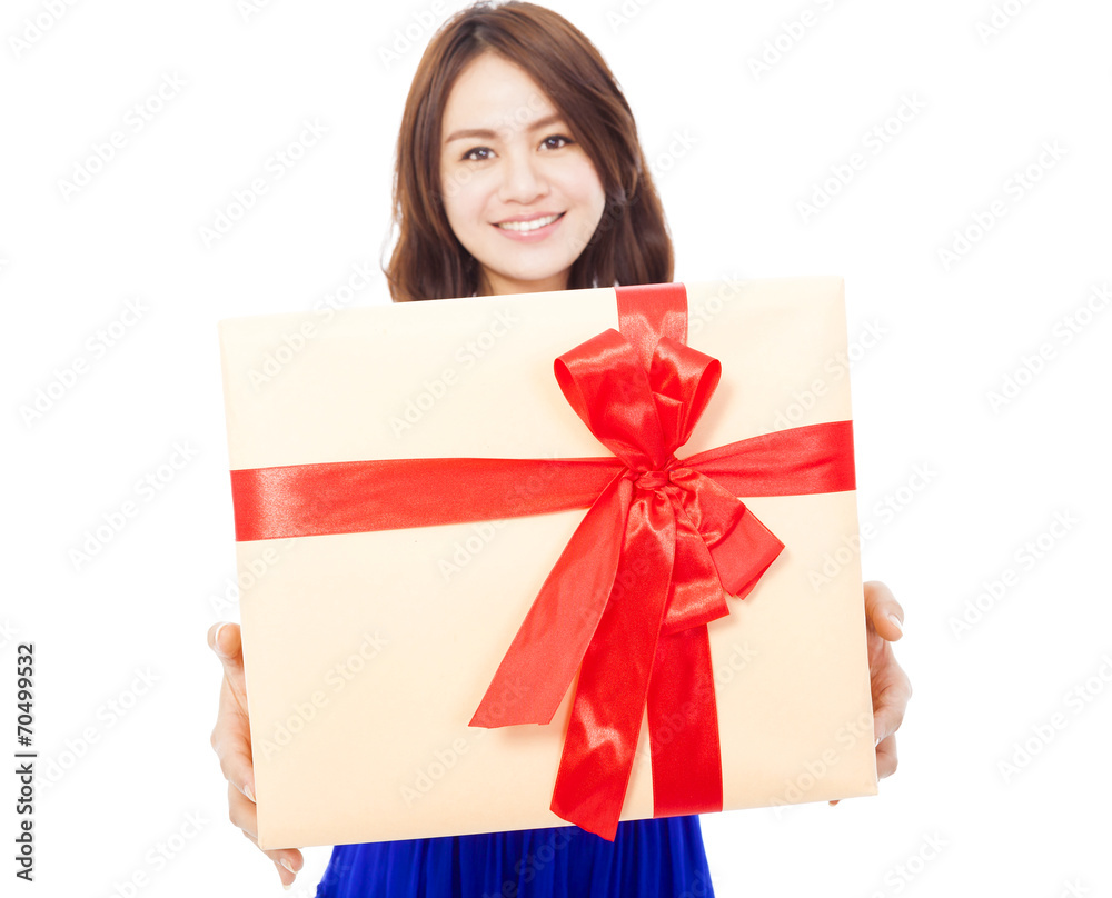 closeup of happy young woman holding a gift box closeup of happy young woman holding a gift box