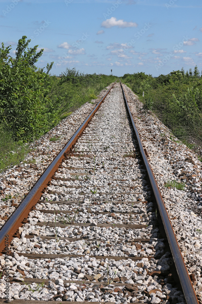 railroad tracks and blue sky with clouds landscape railroad tracks and blue sky with clouds landscape