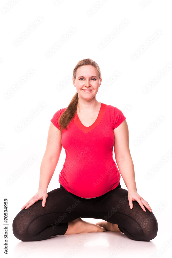 Pregnant woman exercising isolated on white Pregnant woman exercising isolated on white