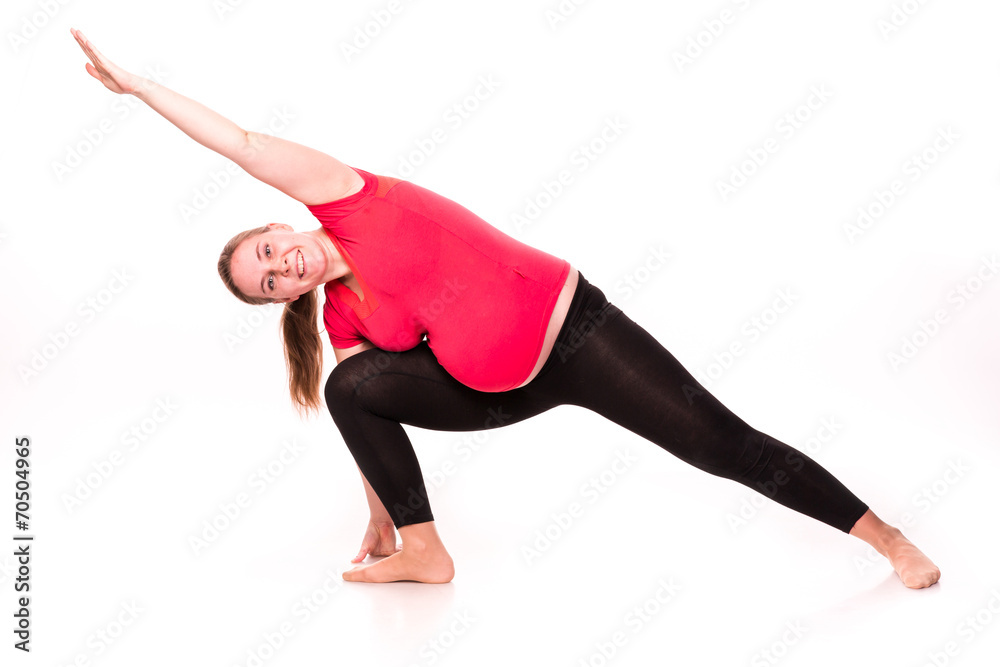 Pregnant woman exercising isolated on white Pregnant woman exercising isolated on white