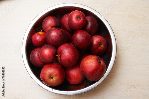 Red juicy apples in a bowl