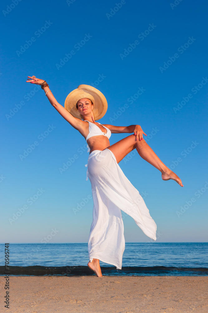 young woman relaxing by the beach