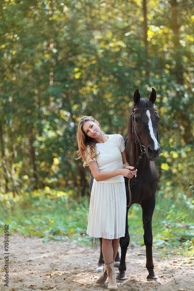 Fototapeta premium Cute woman with horse