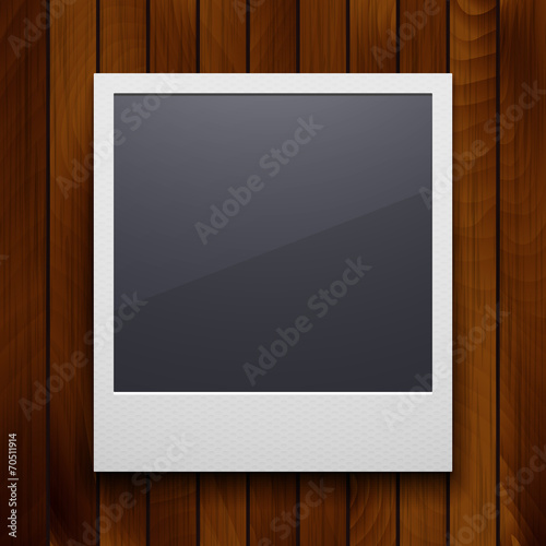 Retro photo frame isolated on red wood texture background