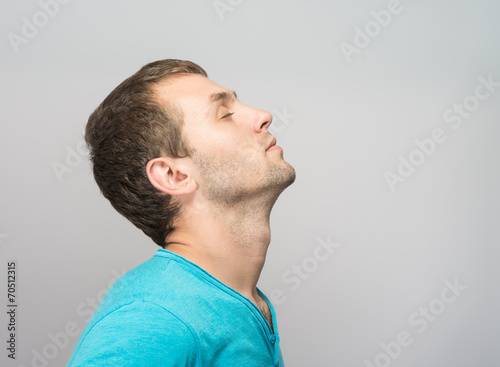 man relaxing with closed eyes