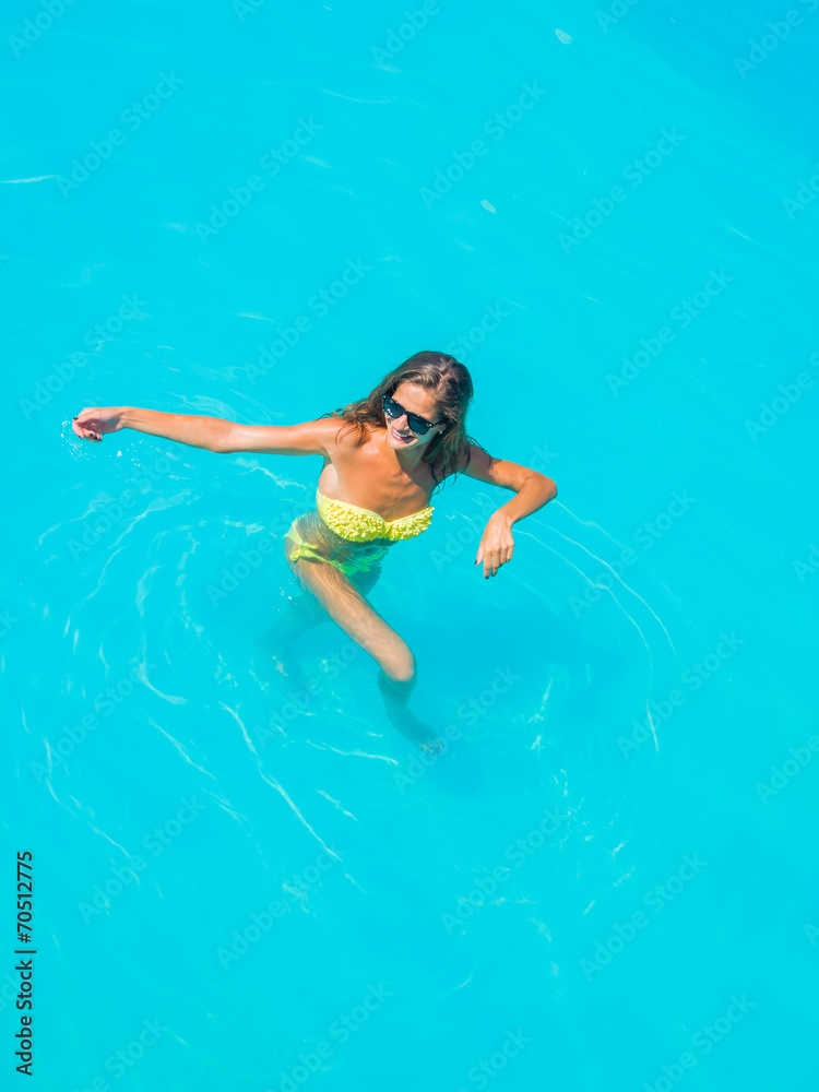 woman in bikini at the swimming pool