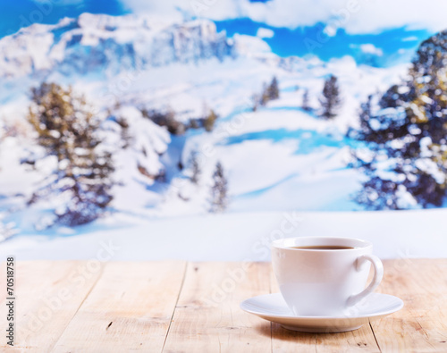 cup of coffee over winter landscape