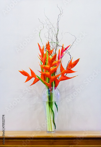 Heliconia wagneriana inflorescence in a glass vase photo