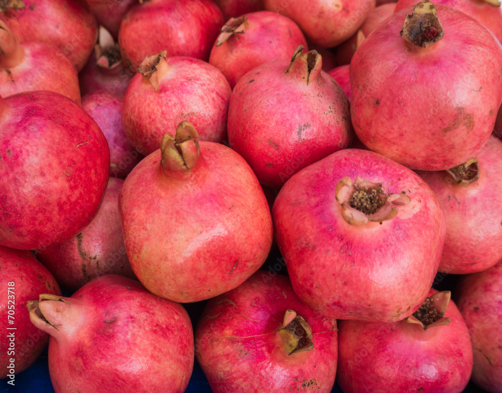 Pomegranates at the Market. Fresh farmer's market pomegranates. Pomegranates at the Market. Fresh farmer's market pomegranates.