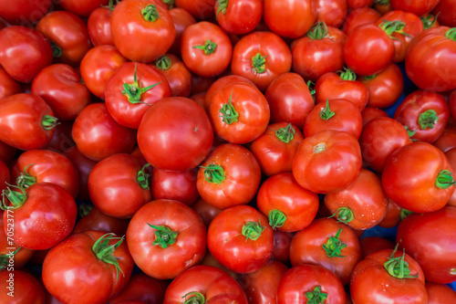 red tomatoes at the market. Fresh ripe tomatoes