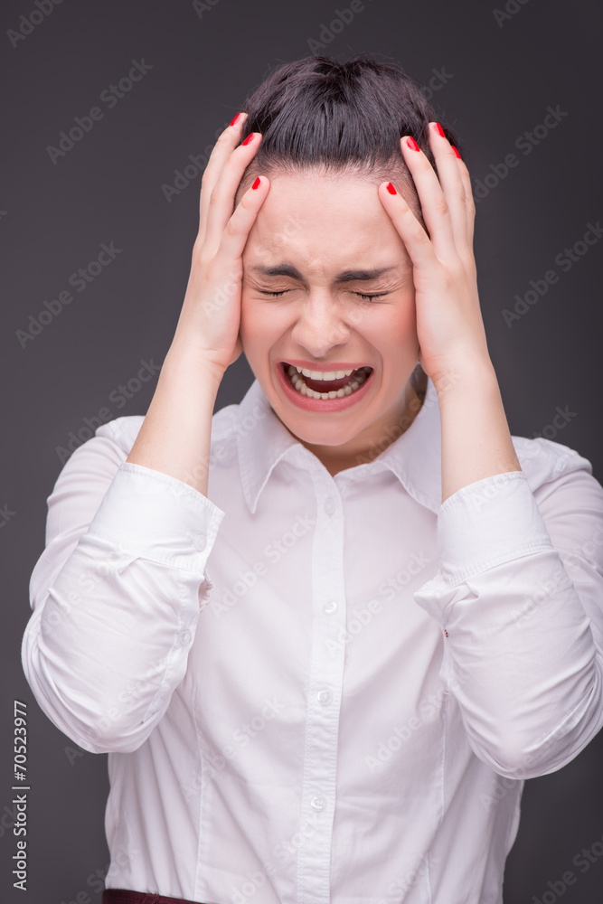 Naklejka premium Serious woman wearing white blouse