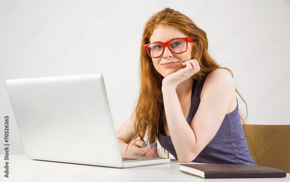 Pretty redhead working on laptop Pretty redhead working on laptop