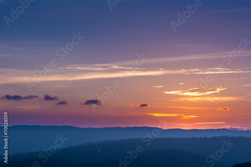 Colorful sunset over the mountain hills © Atip R