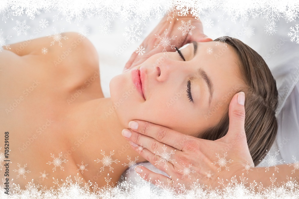 Attractive young woman receiving facial massage at spa center Attractive young woman receiving facial massage at spa center