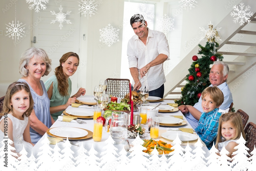 Composite image of family having christmas meal at dining table