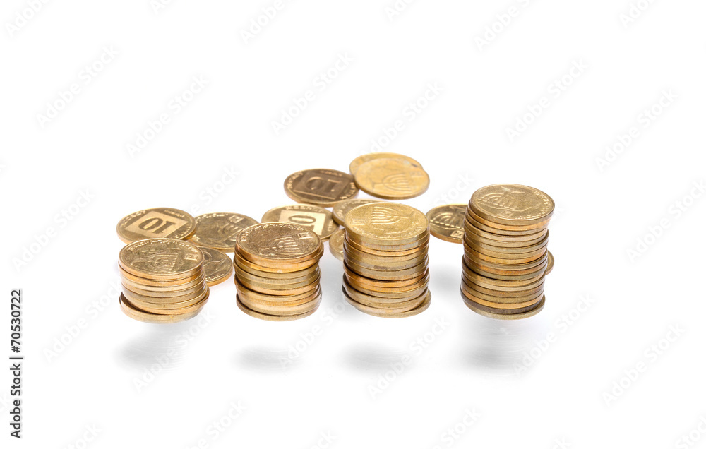 Vertical money stack with scattered coins Vertical money stack with scattered coins
