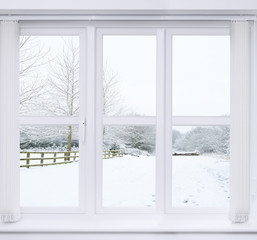 Tableau sur plexiglas Hiver Vue hivernale enneigée depuis une fenêtre givréе  © Springfield Gallery