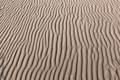 geometric patterns in sand at beach