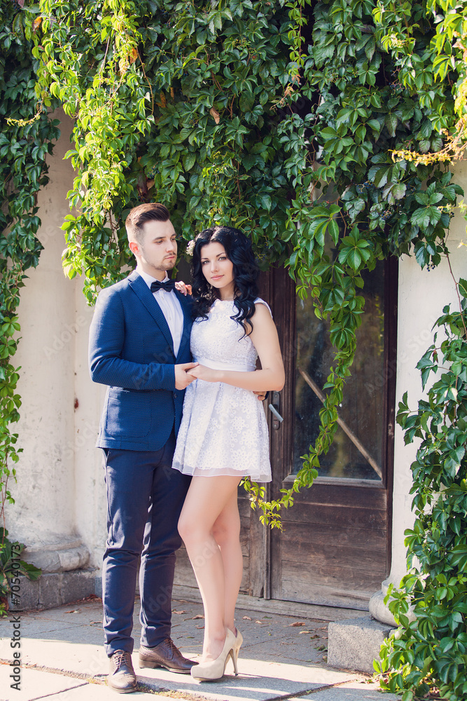 Wedding shot of bride and groom in green park