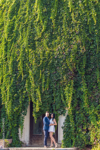 Wedding shot of bride and groom in green park © A.Kazak