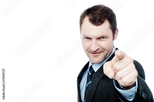 Handsome businessman pointing at you