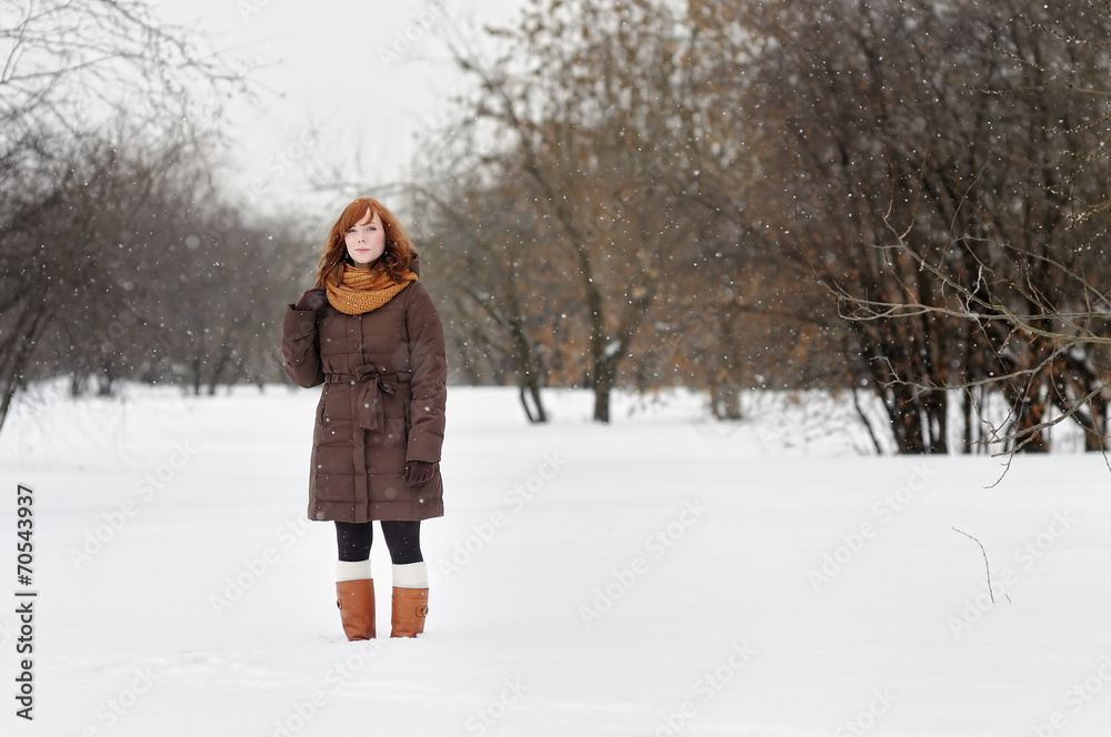 Beautiful woman in winter park