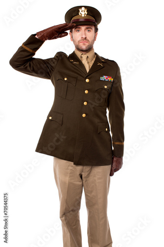 Obraz na plátně Army officer saluting, studio shot