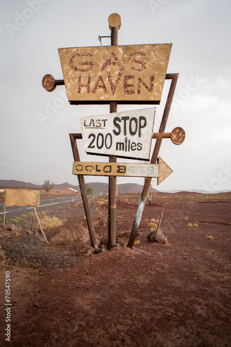 Tall vintage gas sign standing in the desert