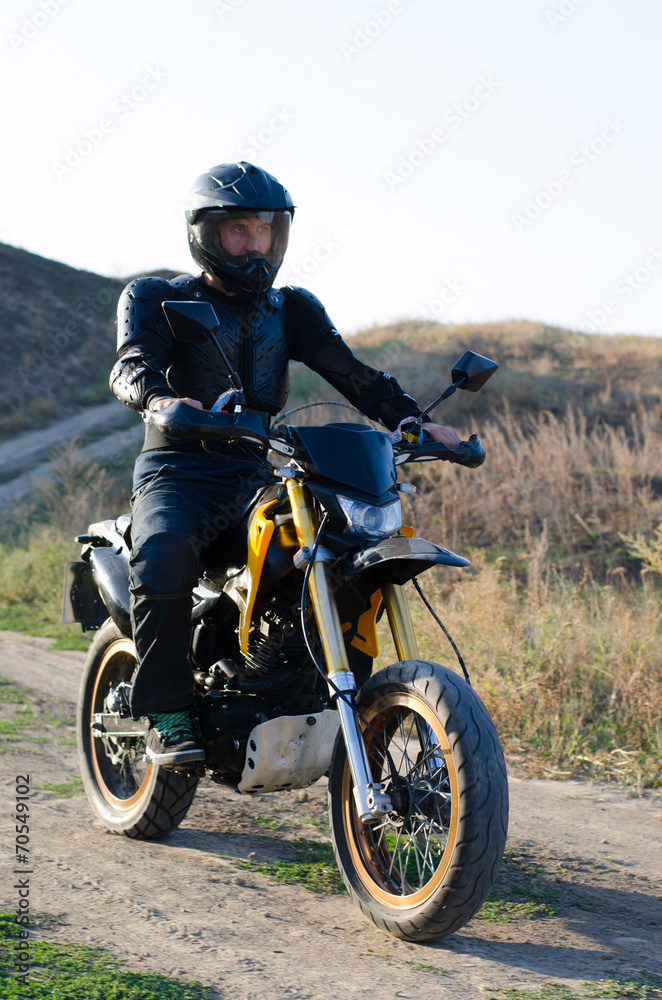 Rider on sport bike for enduro on motocross track Rider on sport bike for enduro on motocross track