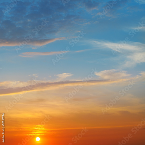 the sun rays illuminate the sky above the horizon