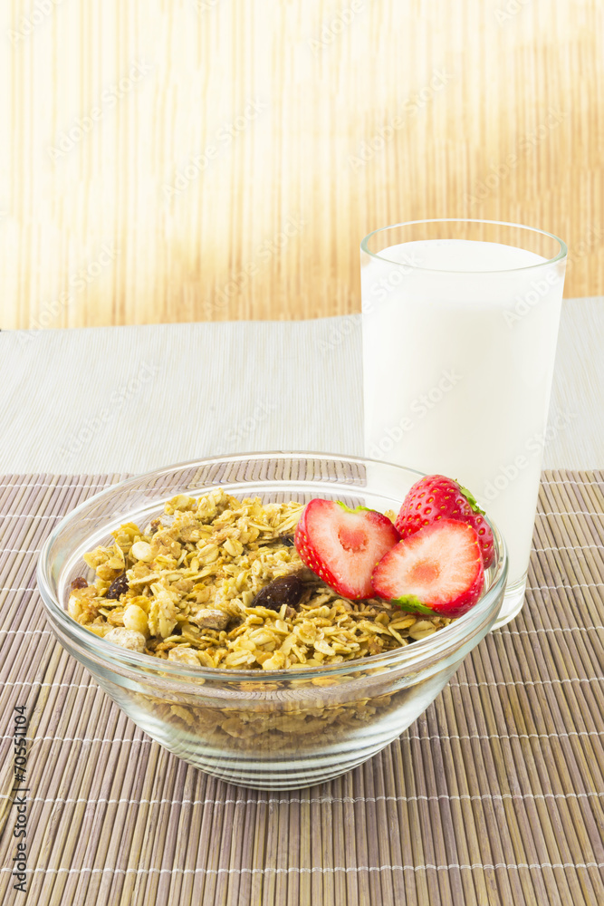 Cereal with strawberries and milk on the mat Cereal with strawberries and milk on the mat