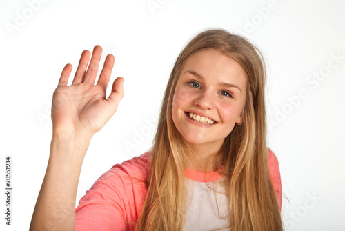 Scandinavian cute young girl waving with her hand