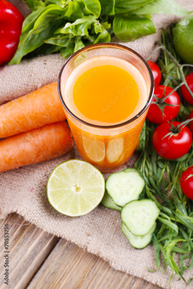 Glass of fresh carrot juice and vegetables Glass of fresh carrot juice and vegetables