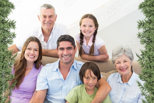 Composite image of smiling multigeneration family