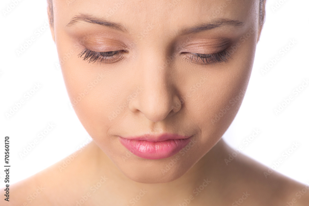Beautiful makeup woman face looking down. Beautiful makeup woman face looking down.