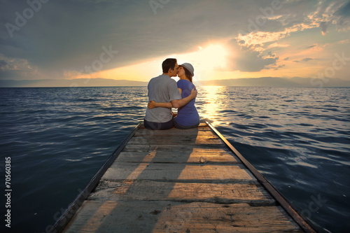 Young couple kissing at sunset