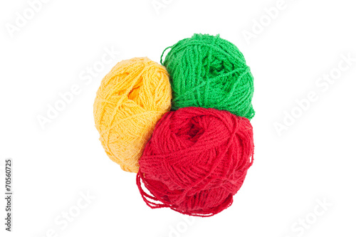Green yellow red skeins of wool isolated on a white background