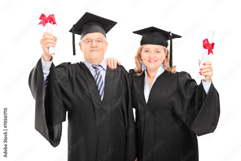 Mature couple celebrating their diplomas Mature couple celebrating their diplomas