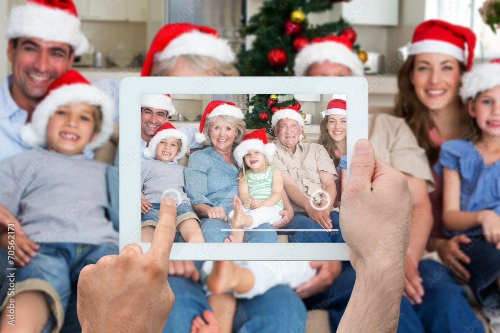 Fototapeta premium Composite image of hand holding tablet pc