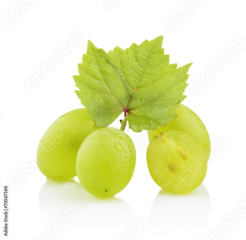 Photo of some grapes with leaves isolated on white